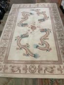 A large modern Chinese woollen dragon rug by GH Frith 274 x 183 cm