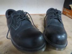 A pair of new unused Doctor Martens steel toe cap shoes size 13
