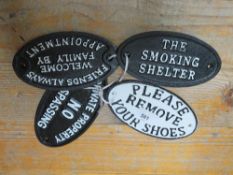 Four oval cast iron signs**