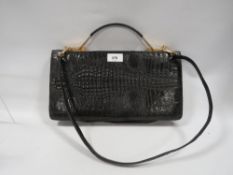 A vintage alligator skin type handbag