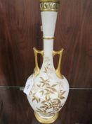 A pierced tall twin handled blush ivory Royal Worcester vase decorated with blackberries and