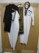 A large vintage patchwork style bed cover together with two Arabic style robes, one headdress and