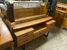 A mid-century teak dressing table