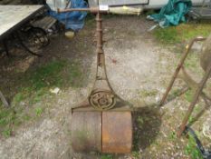 An antique garden roller