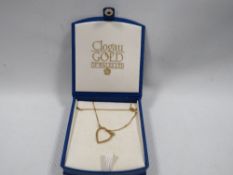 A boxed small gold hallmarked 9 carat heart shape pendant approx. 2.2g