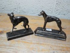 A retriever and greyhound figure **