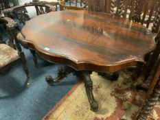 An antique rosewood shaped centre table S/D