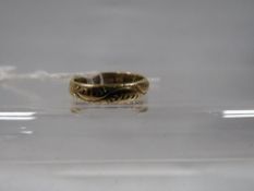 A hallmarked 18 carat gold band approx. weight 4.2g