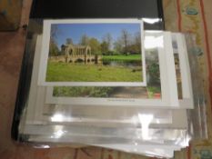 A selection of unmounted and mounted photographic prints