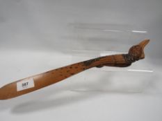 A novelty black forest style page turner carved in the form of a bird with spring action beak