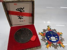 A Chinese warlord type enamel medal and another boxed Chinese medal