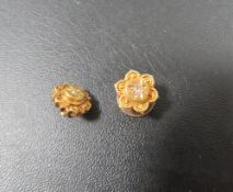 Two 15ct earrings set with a diamond chip with screw back fitting - one backing missing approx.