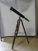 A vintage brass and leather telescope