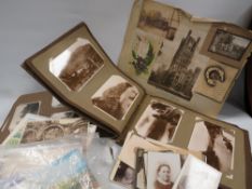 An edwardian postcard album and contents, a photograph album of girl guide interest and a quantity