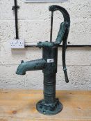 A cast metal garden pump **