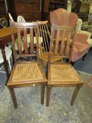 Two oak bergere chairs with barleytwist legs
