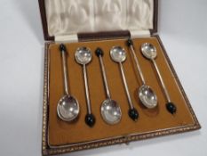 A cased hallmarked silver cased set of coffee spoons