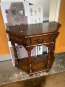 A carved oak Credence style table H 91 W 92 cm