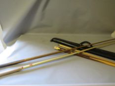 A selection of snooker and pool cues