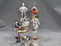 A collection of seven assorted continental figurines A/F
