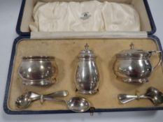 A hallmarked silver cased cruet set by Mappin & Webb