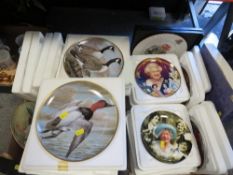 Two trays of collectors plates to include Franklin mint water birds of the worlds and Danbury