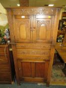 An oak carved drinks cabinet - W 70 cm