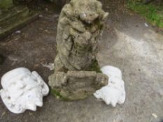 A lion garden statue and 2 concrete wall hanging planters
