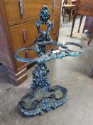 A cast iron stick stand with grapevine decoration