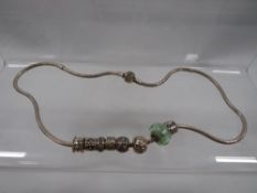 A Pandora style necklace and charms