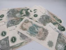 A collection of 17 vintage one pound notes