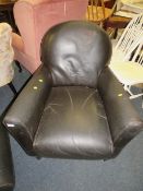 A brown leather club chair with footstool A/F