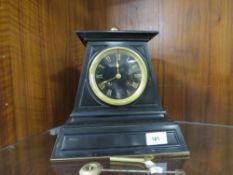 A Victorian Egyptian style black slate mantle clock with an 8 day Japy bell strike movement with