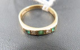 A hallmarked 18 carat gold emerald and diamond ring approx. weight 3.5g