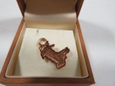 A boxed Clogau gold novelty 9 carat hallmarked pendant in the form of the map of Wales approx..