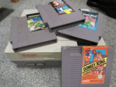 A vintage Nintendo entertainment system NES version with games and accessories (unchecked)