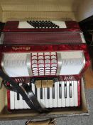 A cased Galotta vintage accordion in red finish