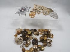 A collection of military badge and buttons etc