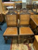 A set of four antique oak bergere dining chairs S/D