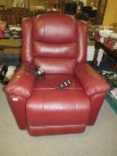 A maroon leather Careco electric recliner armchair