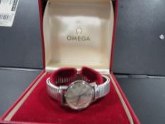 Omega - a vintage wrist watch on expandable steel bracelet in original box Dia 2.5cm