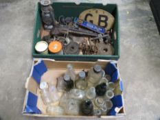 Two trays of sundries to include glass bottles and tools etc