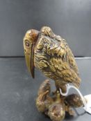 A novelty cast gilt metal figure of a vulture and a brood of five chicks