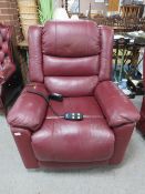 A maroon leather Careco electric recliner armchair