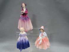 Three small Royal Doulton figurines to include 
