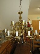 A large brass Flemish style 18 branch chandelier, H 62 cm approx.