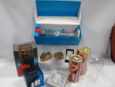 A tray of sundries to include two 'The Club' Swatch watches and two unopened Jean Paul Gaultier perf