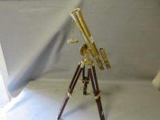 A brass telescope on a tripod
