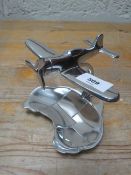 A polished aluminium plane and map **