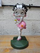 A pink Betty Boop doorstop **